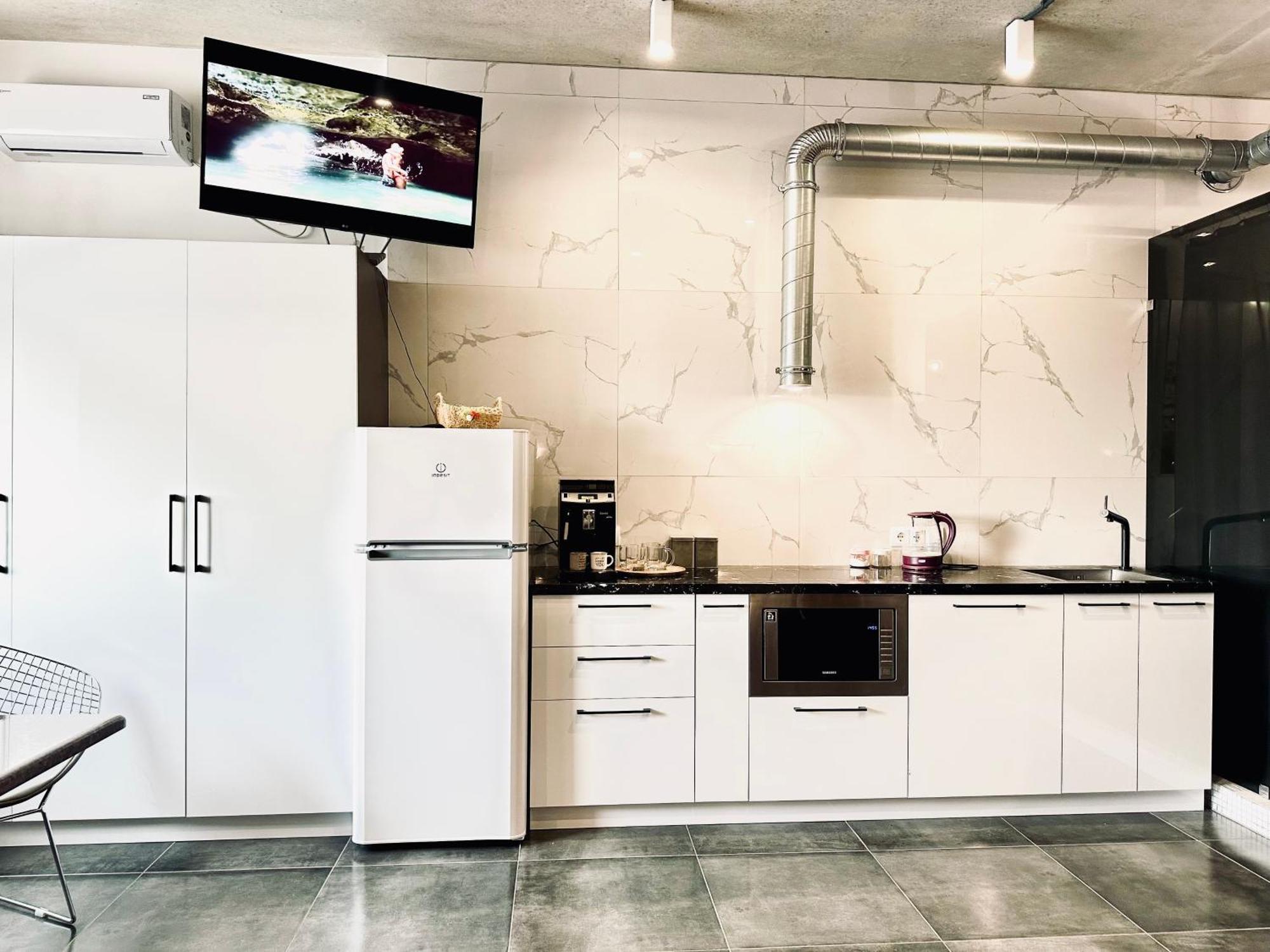 Modern With A Coffee Machine In The Center, A View Of The *