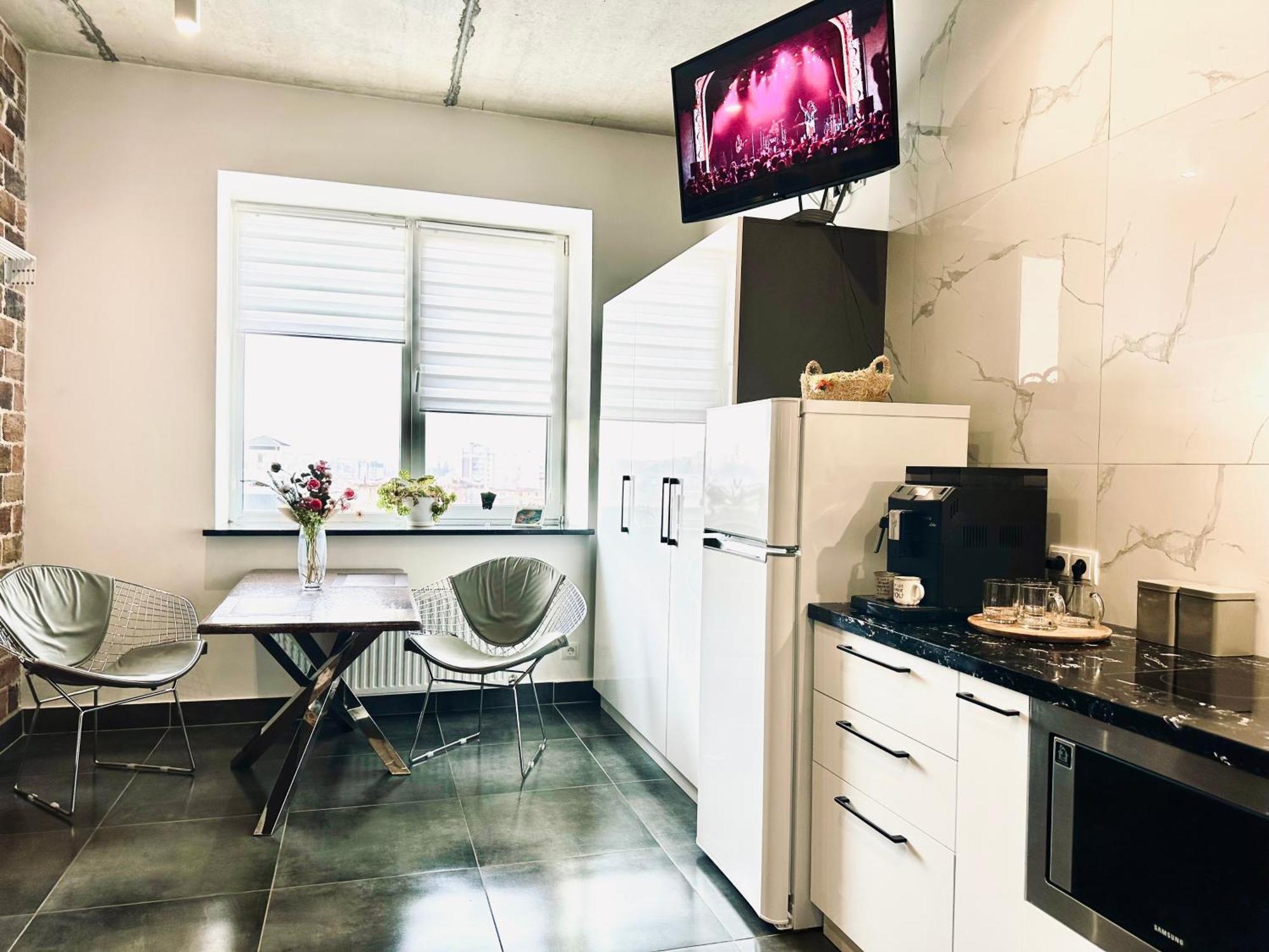 Modern With A Coffee Machine In The Center, A View Of The * Rivne